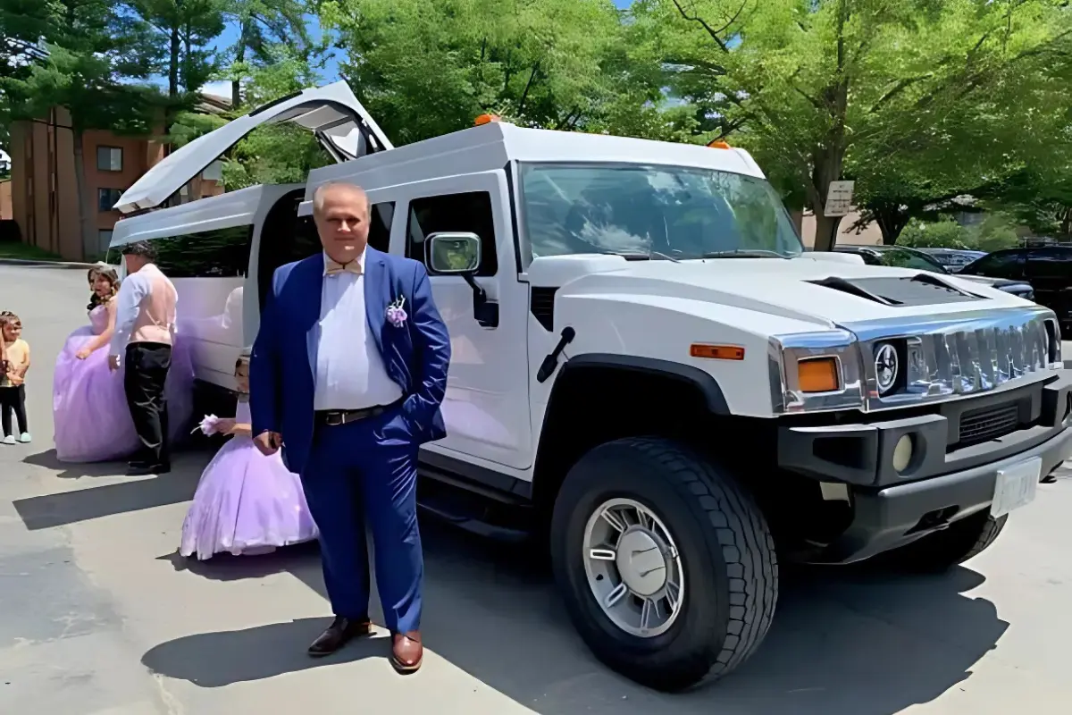 Chauffeur with hummer limo